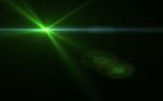 Green Digital Lens Flare In Black Background Horizontal Frame Wa Stock Photo