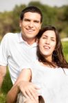 Young Couple Sitting Stock Photo