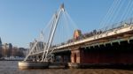 People Crossing Hungerford Bridge Stock Photo