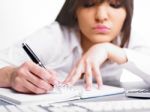 Business Lady Writing On Notebook Stock Photo