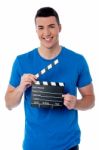 Smart Guy Holding Clapperboard Stock Photo