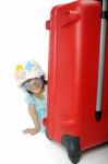 Little Asian Girl In A Weave Hat And Sunglasses Sitting Behind H Stock Photo