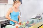 Woman In Kitchen With Laptop Stock Photo