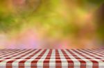 Picnic Table With Blurred Autumn Leaves Background Stock Photo