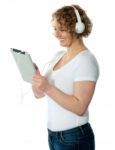 Lady Listening Music On Tablet Pc Stock Photo