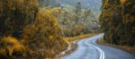 Road And Mountains In The Tasmanian Countryside Stock Photo