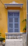 Old Colonial Balcony In A Historic Yellow Building In Cartagena, Stock Photo