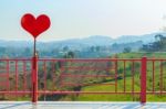 Red Heart And Pink Fence Stock Photo