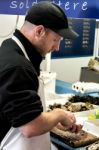 Whitstable, Kent/uk - September 1 : Man Opening Oysters In Whits Stock Photo