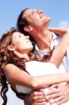 Couple Facing Sky Together Stock Photo