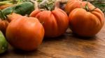 Several Vegetables On Wooden Chopping Board And Table Stock Photo