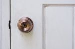 Door Knob And Keyhole On White Wooden Door Stock Photo