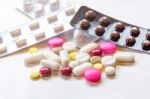 Top View Of The Pills On The White Background, Pack Of Tablet Drug And Capsule Pills On The Floor Stock Photo