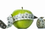 Green Apple And Measuring Tape Stock Photo