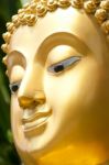 Golden Buddhist Statue Face Stock Photo