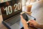 Woman Using Laptop In The Coffee Shop Stock Photo