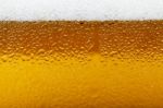 Close-up Picture Of A Beer With Foam And Bubbles Stock Photo