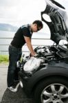 Young Man Checking His Car Stock Photo