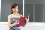 Portrait Of Thai Adult Businesswoman Beautiful Girl Read A Book Stock Photo