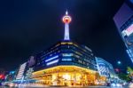 Kyoto Tower At Night In Kyoto, Japan Stock Photo