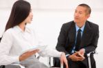 Two Businesspeople In Meeting Stock Photo