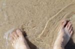 Leg On Sea Water, Top View Stock Photo