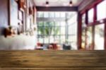 Selected Focus Empty Brown Wooden Table And Coffee Shop Or Resta Stock Photo