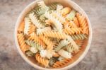 Fusili Pasta In Wooden Plate Stock Photo