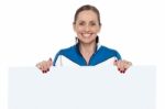 Charming Woman Holding Blank Whiteboard Stock Photo