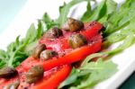 Salad With Fresh Tomatoes, Capers And Arugula Stock Photo