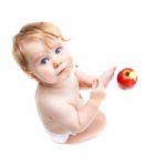 Cute Infant Boy With Apple Stock Photo