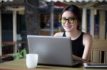 Portrait Of Thai Adult Student University Beautiful Girl Using Her Laptop Stock Photo