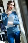 Young Worker Woman With Digital Tablet In Her Office Stock Photo