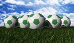 Green Soccer Balls On Grass Stock Photo