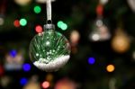 Pine Leaf In Glass Ball Ornament Hanging On Christmas Tree Stock Photo