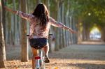 Pretty Young Girl Riding Bike In A Forest Stock Photo