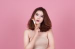 Short Hair Asian Young Beautiful Woman Applying Cosmetic Powder Stock Photo