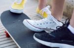 Young Women With Skateboard In The Street Stock Photo