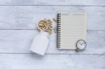 Blank Notebook With White Capsule Container With Vintage Watch Stock Photo