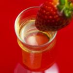 Glass Of Champagne With A Strawberry Stock Photo