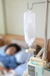 Inpatient On Bed With Bottle Dextrose In Hospital Stock Photo
