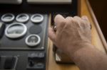 Commander Hands On The Boat Wheel Stock Photo