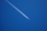 A Long Trail Of Jet Plane On Blue Sky Stock Photo