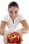 Smiling Woman Giving Apple Stock Photo