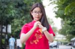 Portrait Of Thai Teen Beautiful Girl In Chinese Dress, Relax And Smile Stock Photo