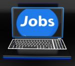 Jobs On Laptop Shows Unemployment Jobless Or Hiring Online Stock Photo