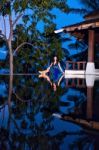 Pretty Brunette Model In Beach Dress Posing At The Pool Stock Photo