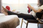 Young Woman’s Hands Knitting Warm Sweaters. Sitting On Old Arm Stock Photo