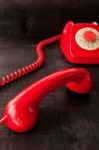 Retro Vintage Red Landline Unhang On Wooden Background Stock Photo