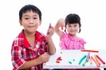 Asian Kids Playing With Play Clay On Table. Strengthen The Imagi Stock Photo